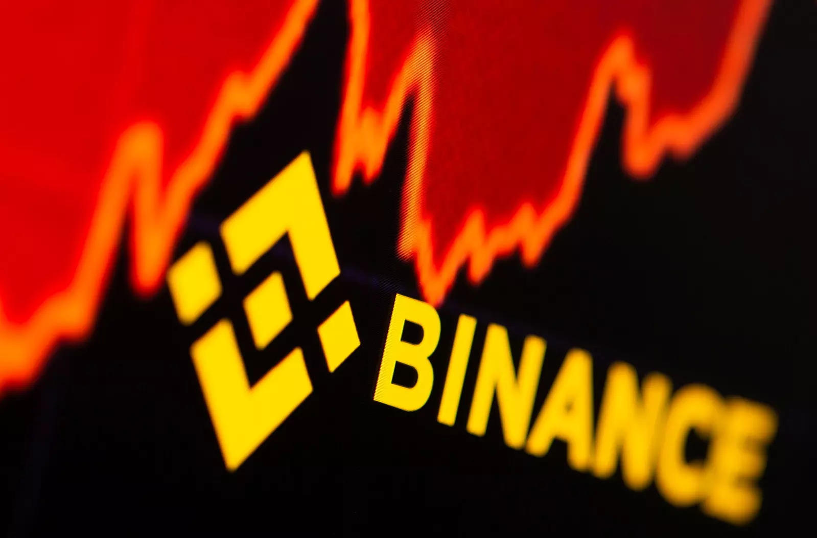 FILE PHOTO: Binance logo and stock graph are displayed in this illustration taken
